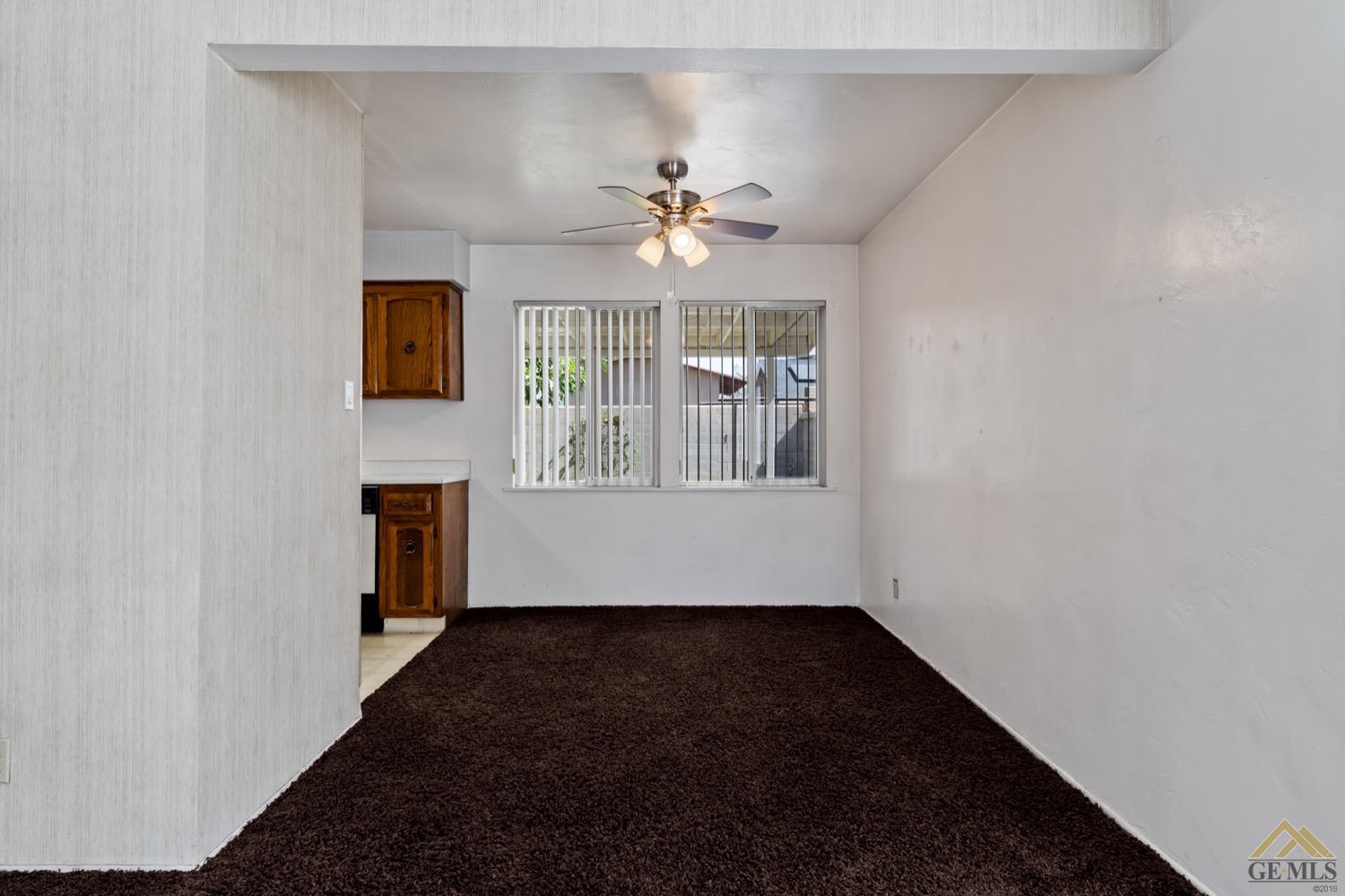 Undisclosed Address Bakersfield, CA 93304 - Photo 12 of 30 wooden floor in an empty room with a window