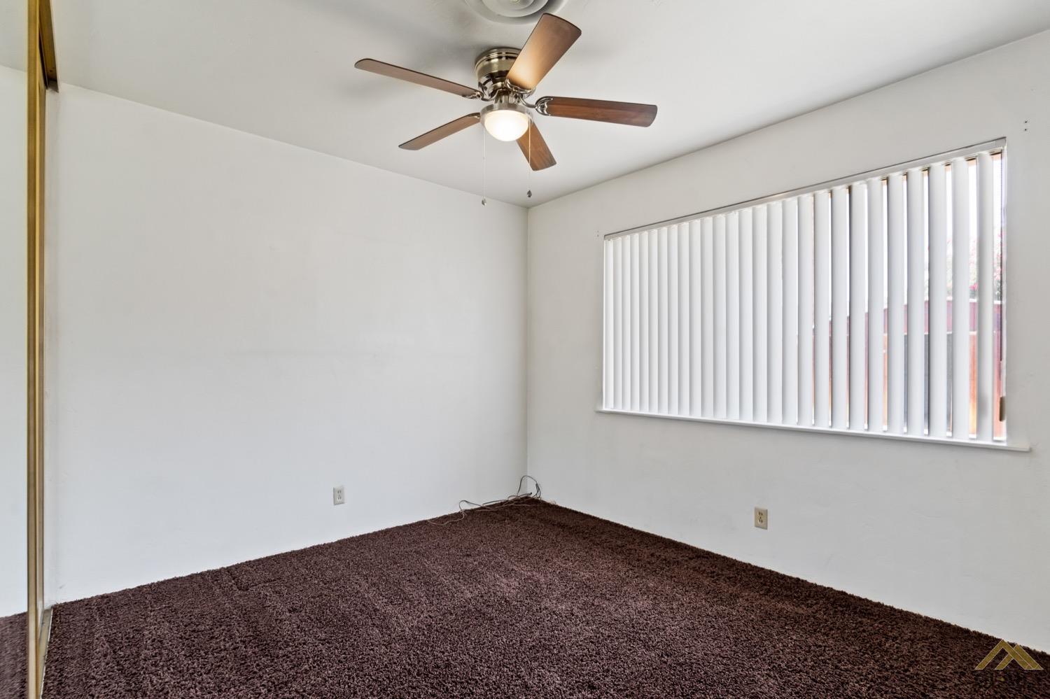 Undisclosed Address Bakersfield, CA 93304 - Photo 22 of 30 a view of an empty room with a window