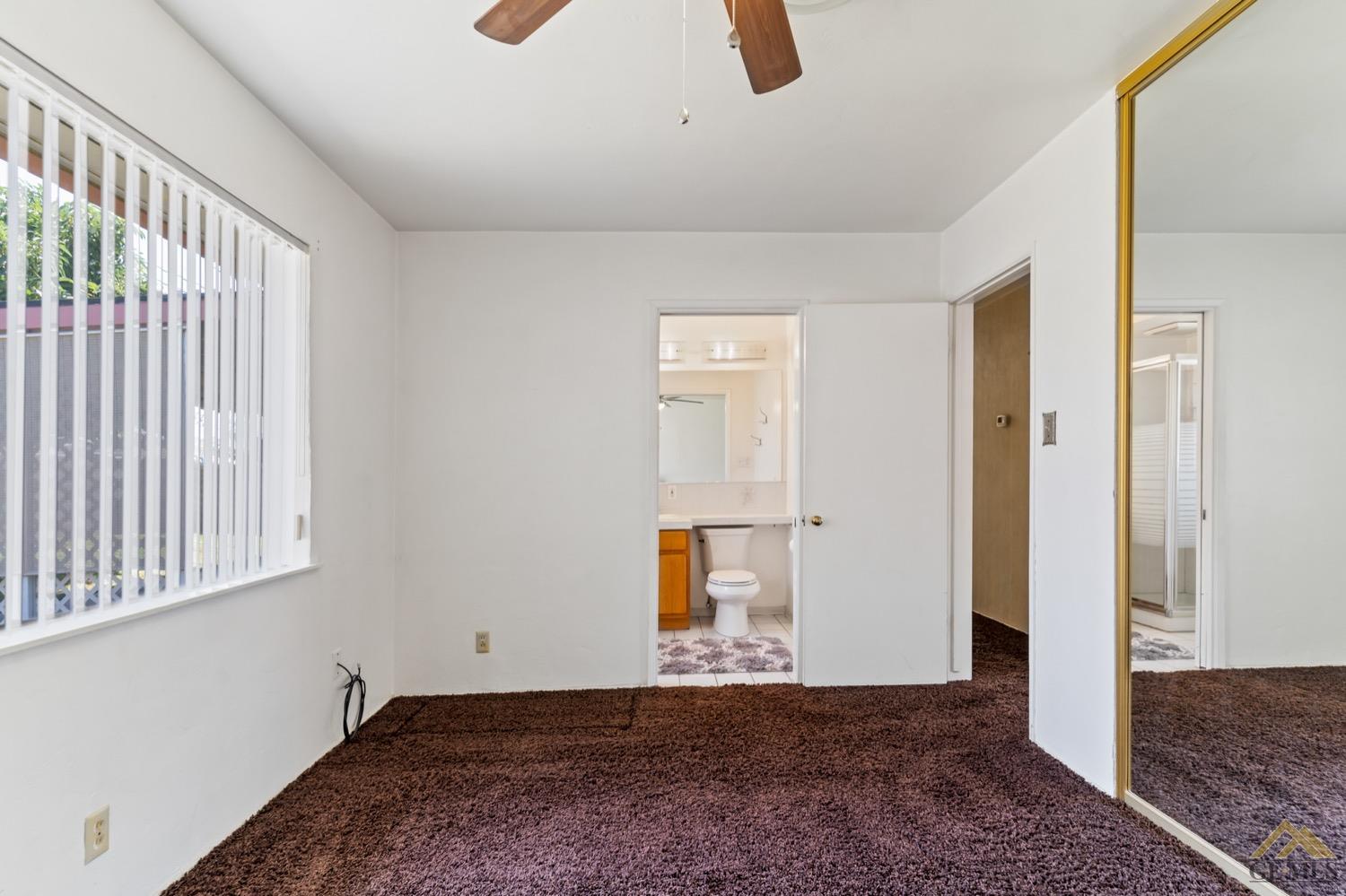 Undisclosed Address Bakersfield, CA 93304 - Photo 23 of 30 a view of an empty room with wooden floor and windows