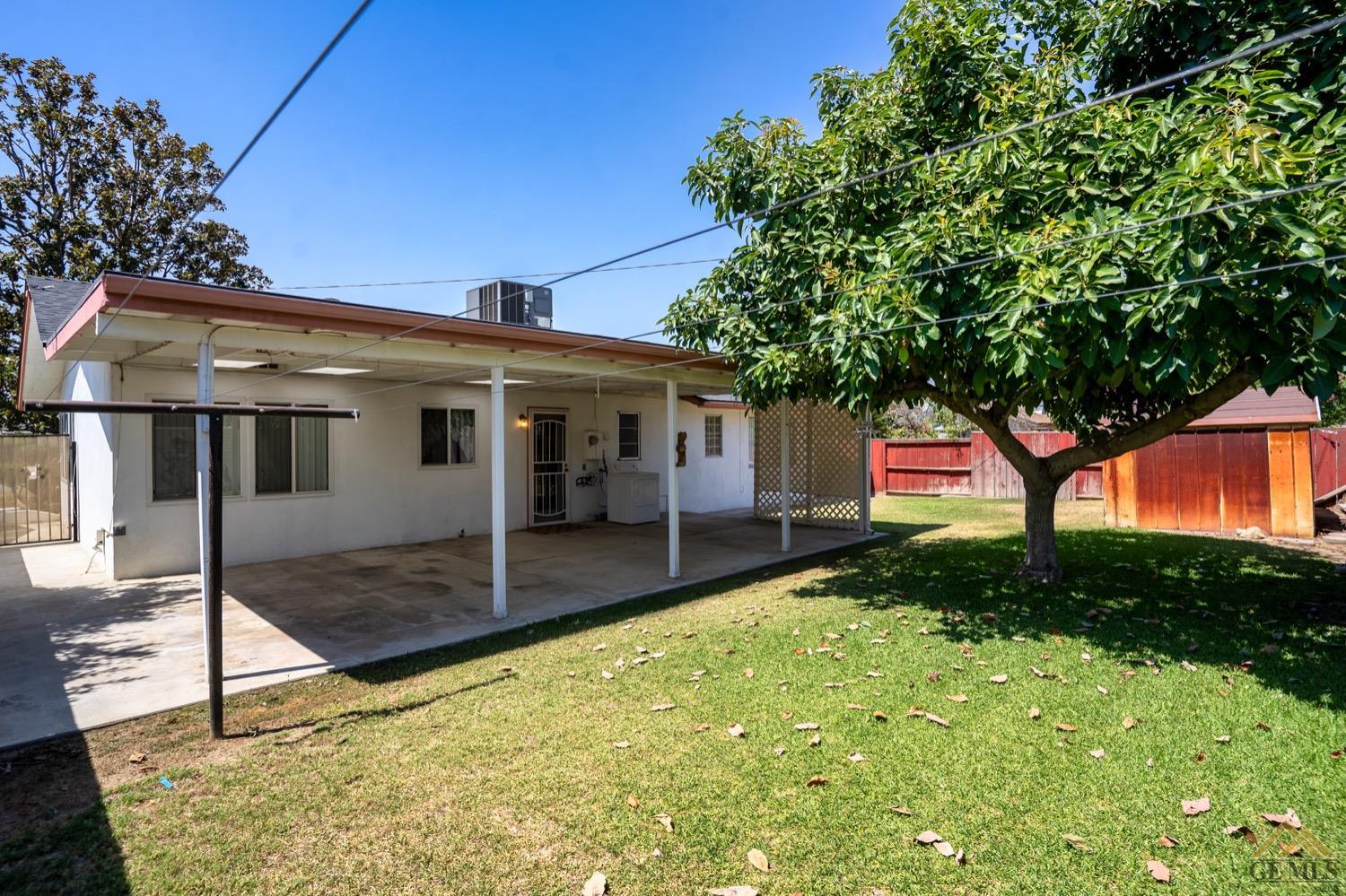Undisclosed Address Bakersfield, CA 93304 - Photo 28 of 30 a front view of a house with garden