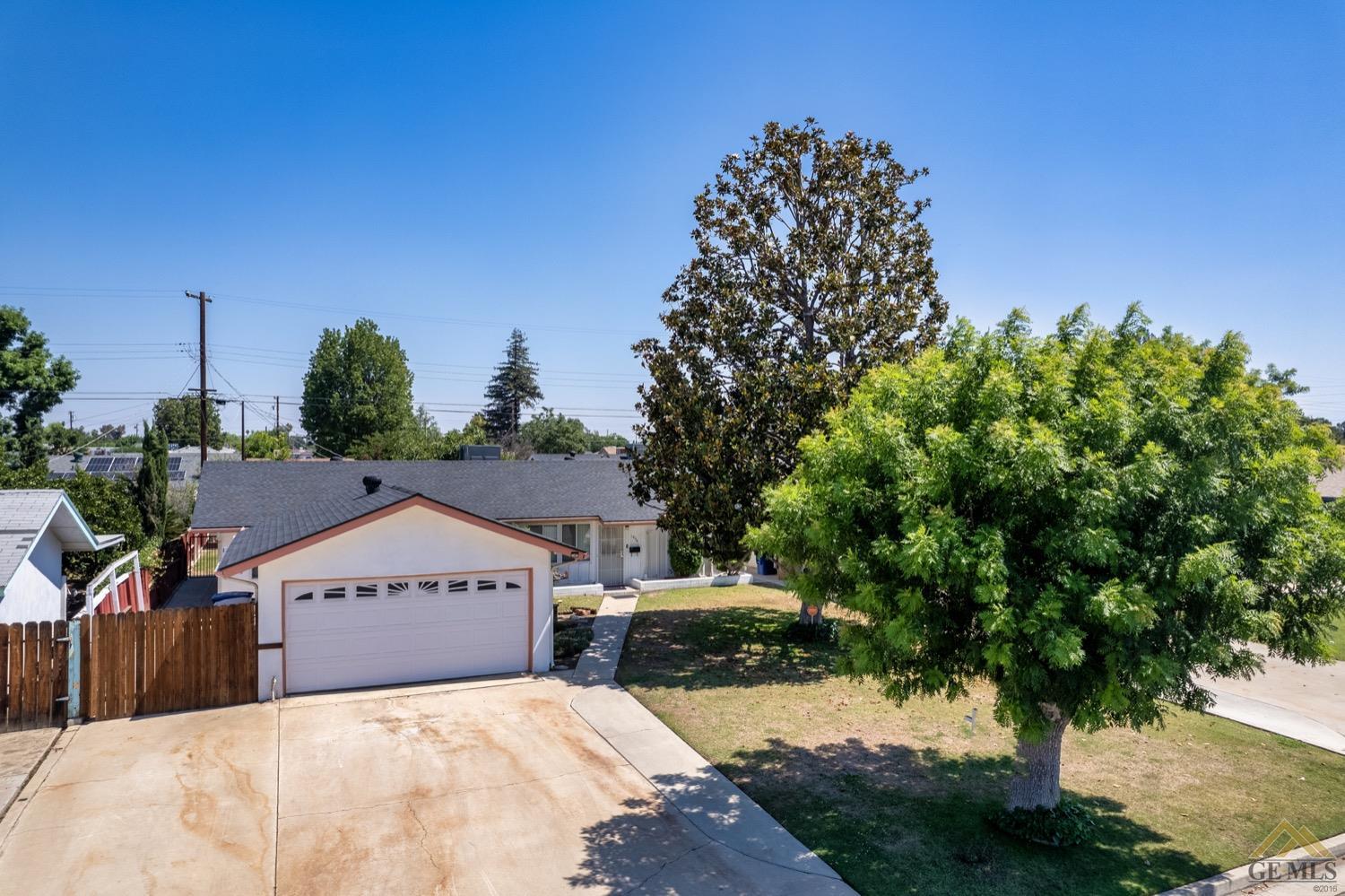 Undisclosed Address Bakersfield, CA 93304 - Photo 4 of 30 a view of a house with a yard