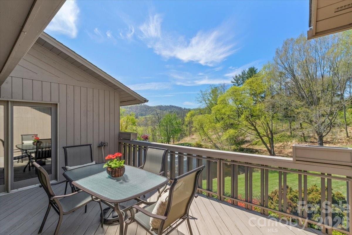 21 Ridge Terrace Asheville, NC 28804 - Photo 11 of 47 a view of balcony with furniture and stove