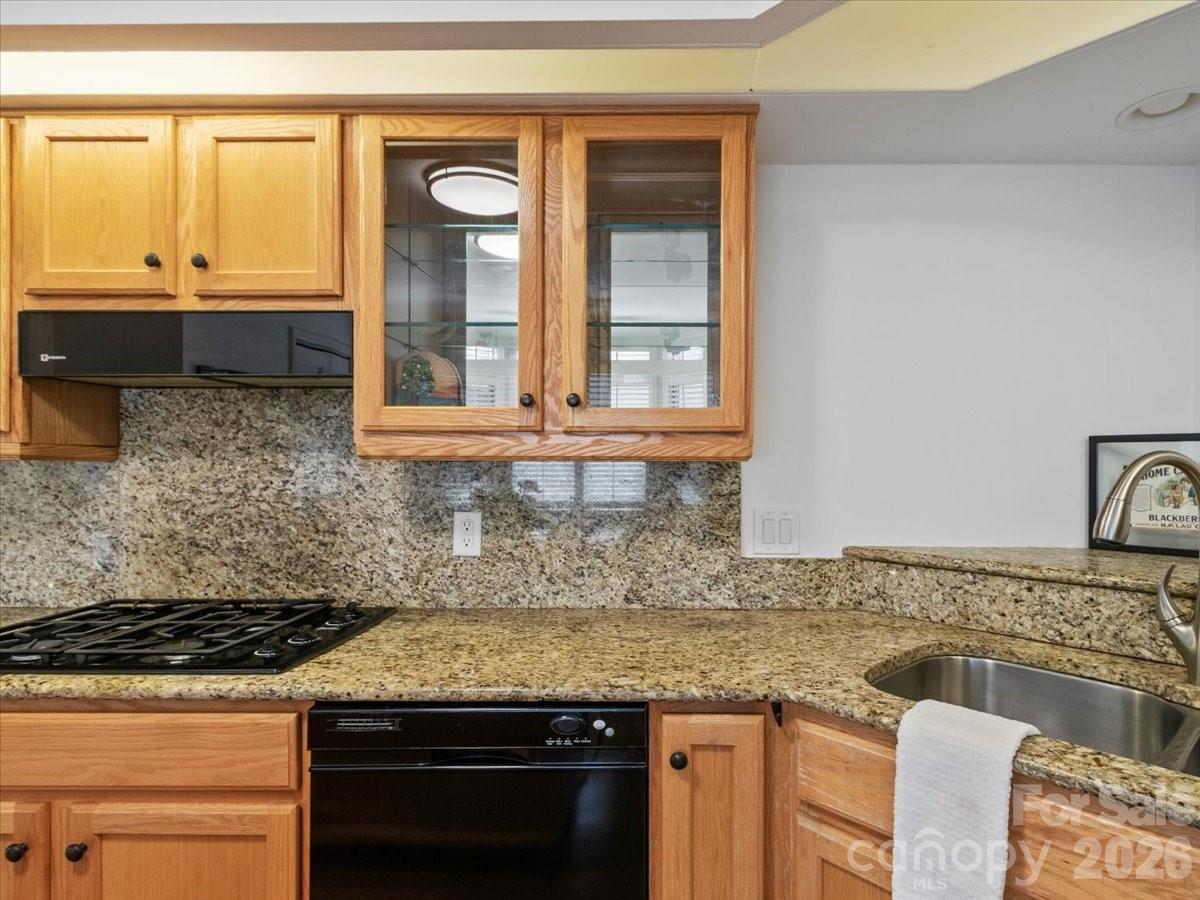 21 Ridge Terrace Asheville, NC 28804 - Photo 18 of 47 a kitchen with granite countertop a sink stove and cabinets