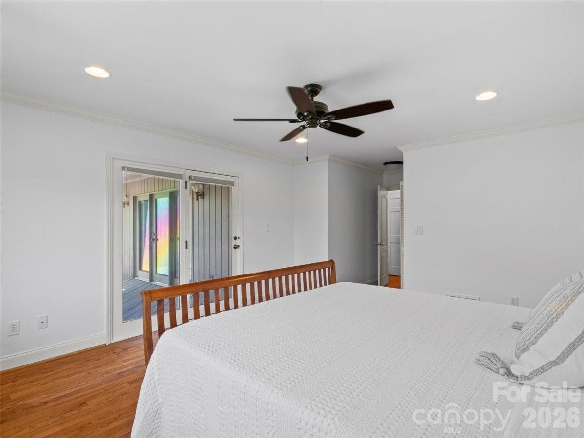 21 Ridge Terrace Asheville, NC 28804 - Photo 23 of 47 a view of a hallway with wooden floor and a ceiling fan