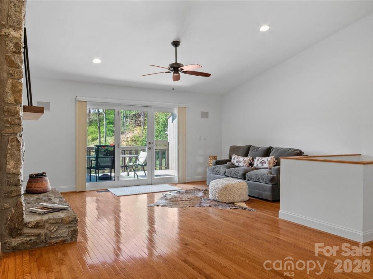 21 Ridge Terrace Asheville, NC 28804 - Photo 3 of 47 a living room with furniture floor to ceiling window and wooden floor