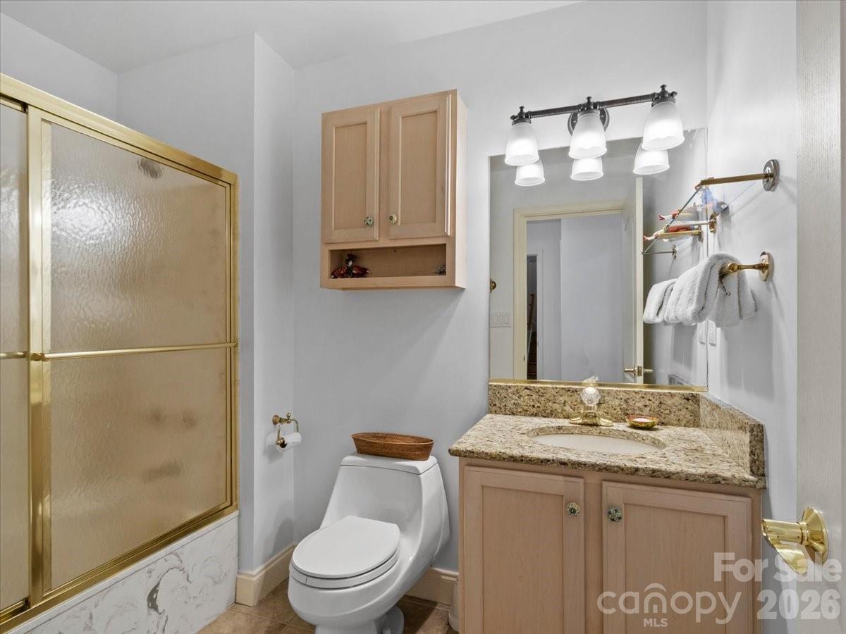 21 Ridge Terrace Asheville, NC 28804 - Photo 41 of 47 a bathroom with a granite countertop sink toilet and shower