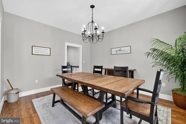 a kitchen with stainless steel appliances kitchen island granite countertop a refrigerator and cabinets
