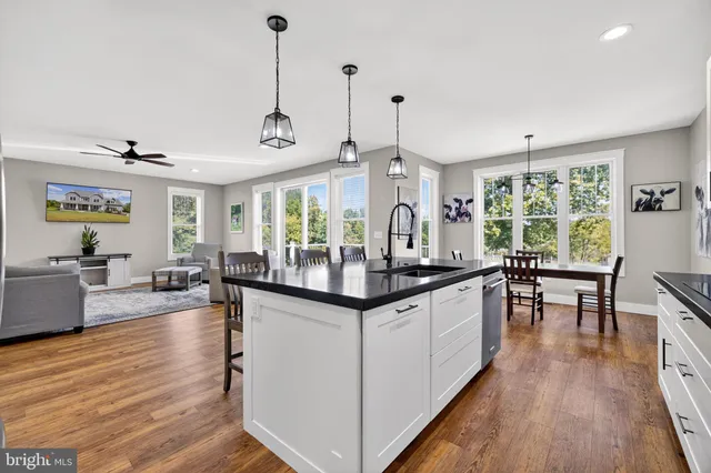 a spacious bathroom with a double vanity sink and a mirror