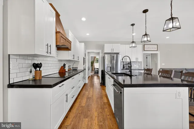 a utility room with sink dryer and washer