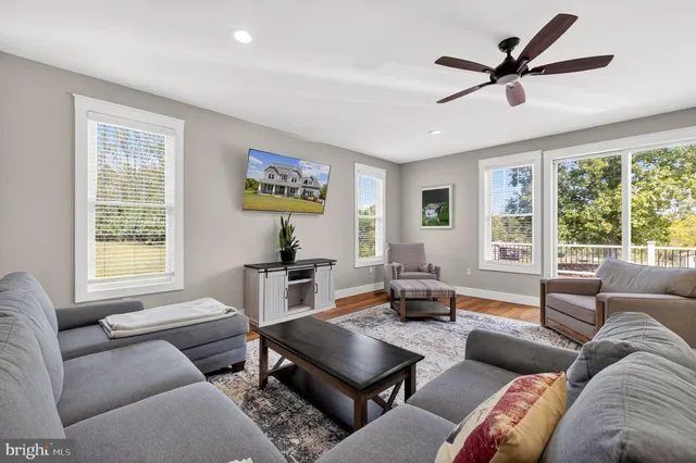a view of a house with wooden deck