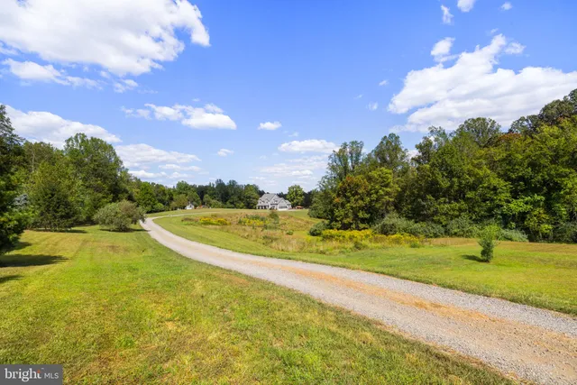 a front view of a house with garden and porch
