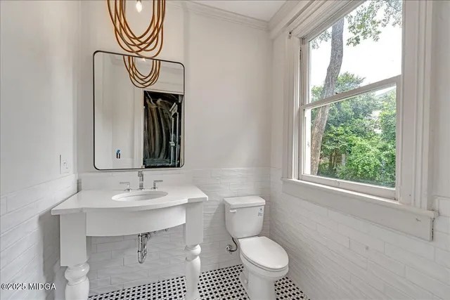 a bathroom with a sink a vanity and a mirror