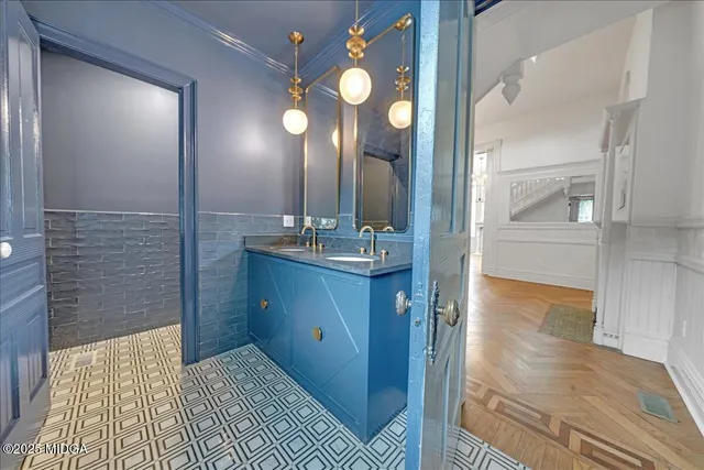 a view of empty room with wooden floor and fireplace