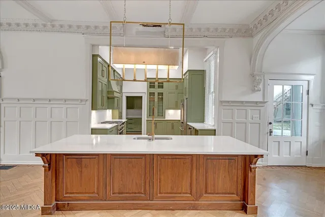 a bedroom with a bed and a chandelier