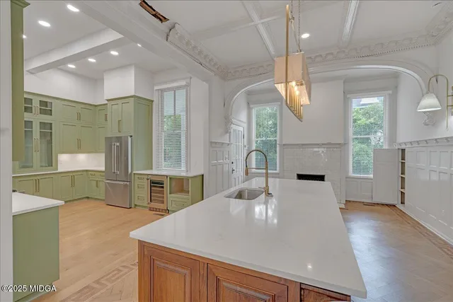 a view of empty room with a fireplace and wooden floor