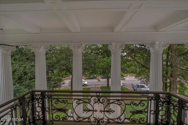 a front view of a house with outdoor seating