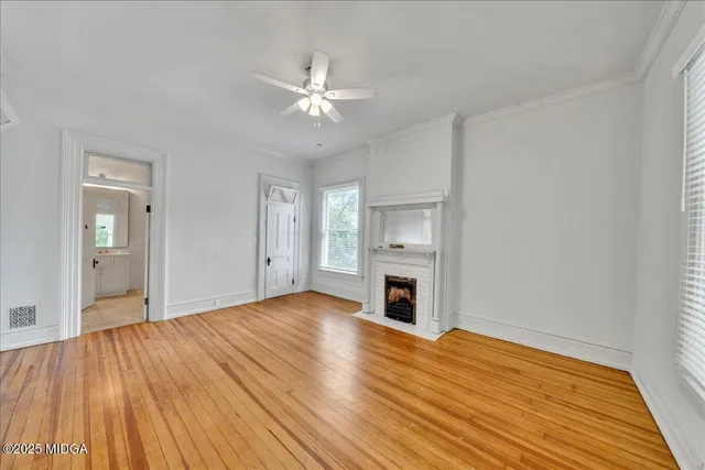 a view of a dining room with furniture and a chandelier