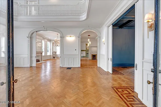 a view of an empty room with windows