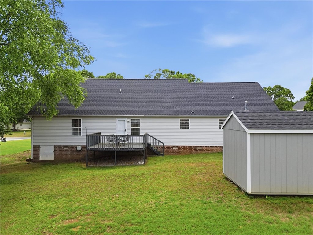 166 Amberwood Drive Anderson, SC 29621 - Photo 30 of 38 This spacious backyard features a deck perfect for entertaining and a convenient storage shed.
