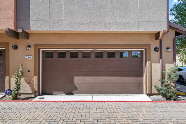 a view of a lush green hillside and houses