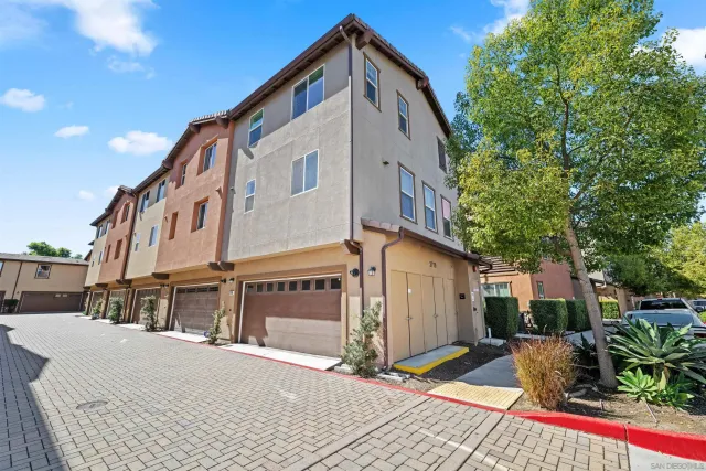 a view of a house with swimming pool and sitting area