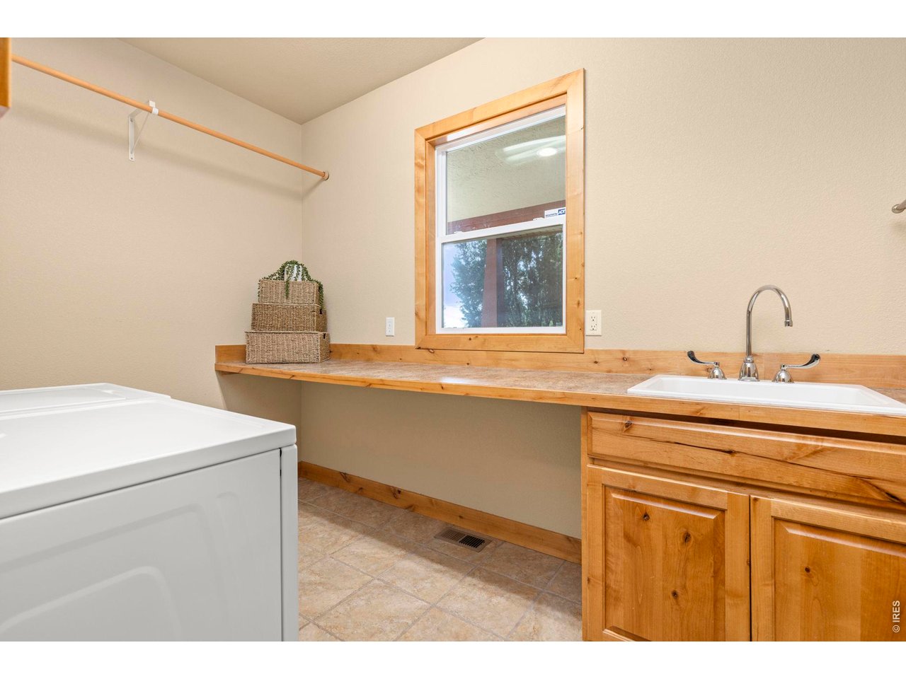 1405 Fox Ridge Parkway Severance, CO 80550 - Photo 27 of 43 Large Laundry Room with Sink and Folding Counter