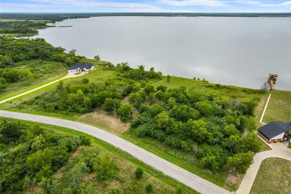 a view of a lake with a yard