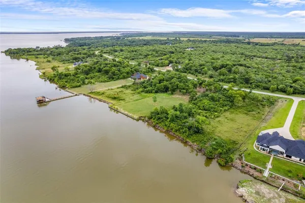 a view of a lake with a yard