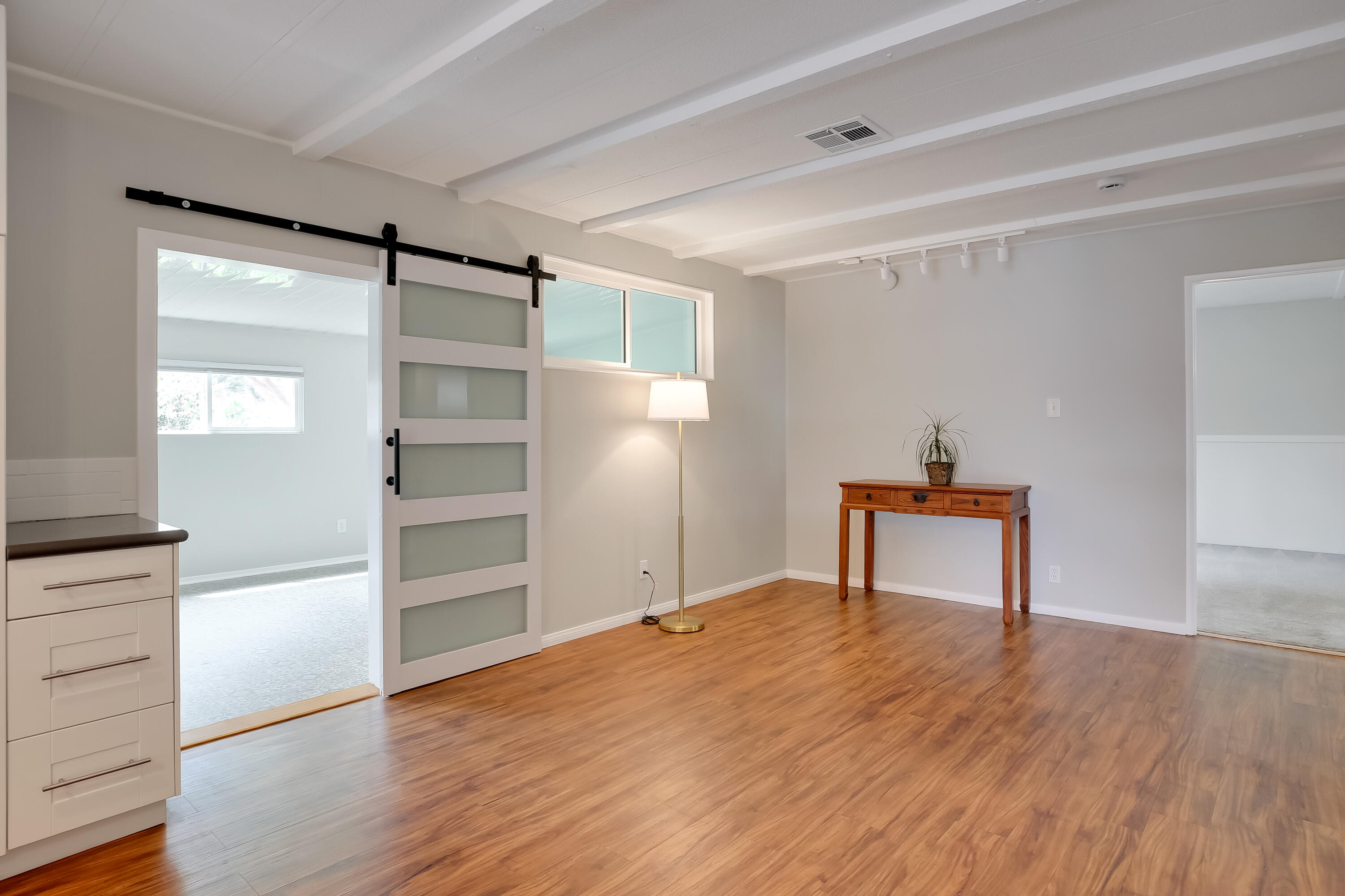 6180 Via Real, Unit 2 Carpinteria, CA 93013 - Photo 10 of 38 Den with slider open to sunroom