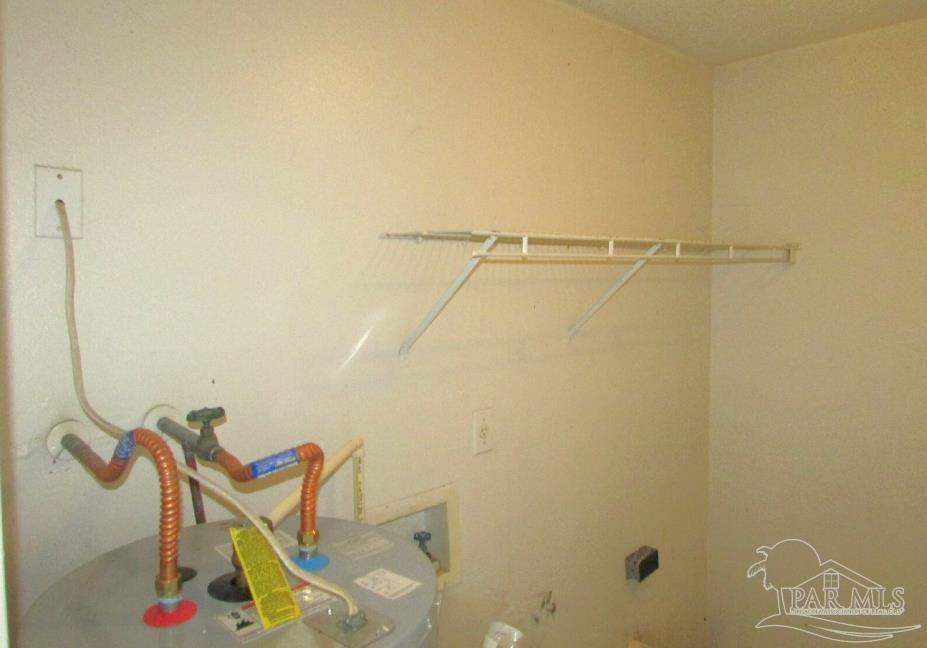 7135 Pearson Road, Unit 7 Pensacola, FL 32526 - Photo 13 of 14 a bathroom with a window and a shower