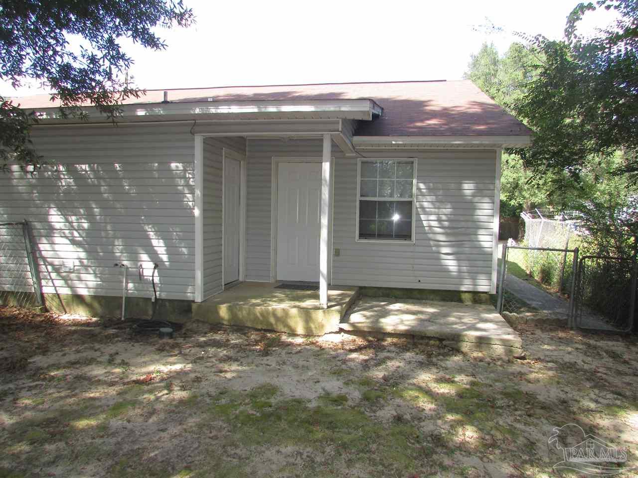 7135 Pearson Road, Unit 7 Pensacola, FL 32526 - Photo 14 of 14 a view of house with yard