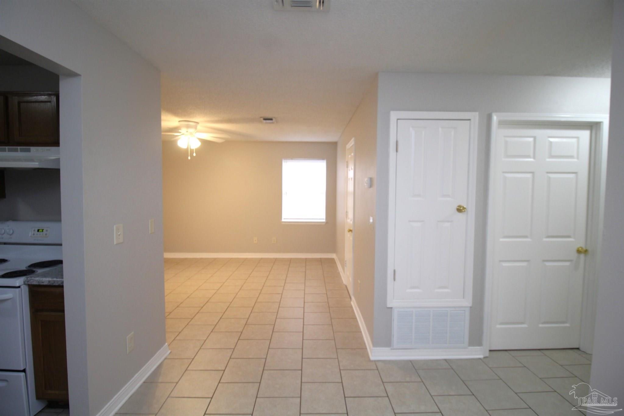 7135 Pearson Road, Unit 7 Pensacola, FL 32526 - Photo 5 of 14 a view of an empty room and fire place