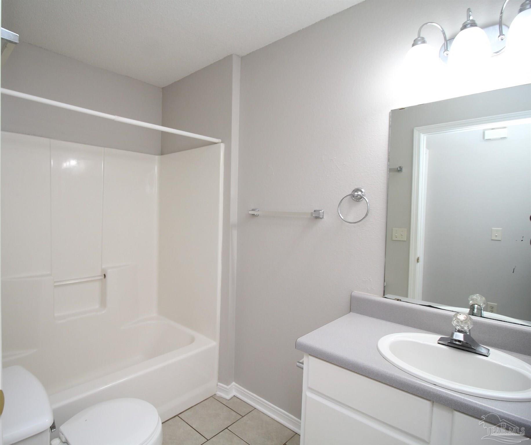 7135 Pearson Road, Unit 7 Pensacola, FL 32526 - Photo 9 of 14 a bathroom with a sink toilet and shower