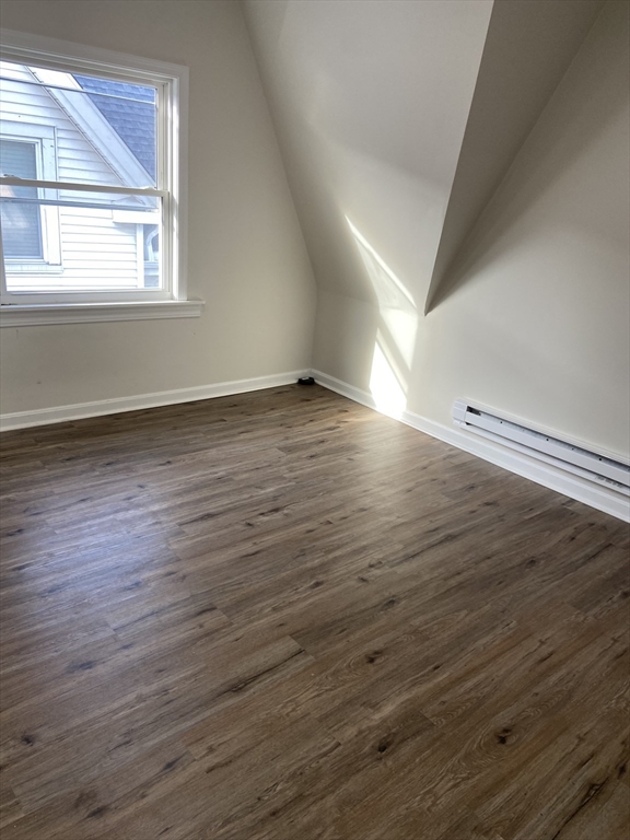92 South Common Street, Unit 5 Lynn, MA 01902 - Photo 4 of 5 wooden floor in an empty room with a window