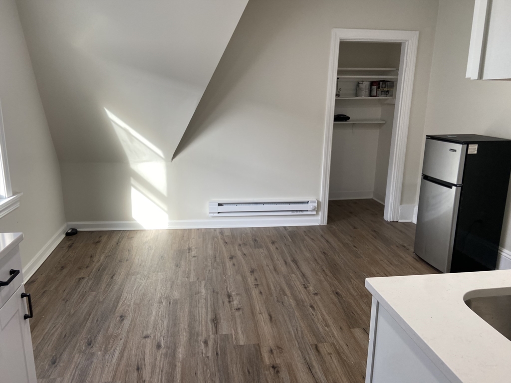 92 South Common Street, Unit 5 Lynn, MA 01902 - Photo 5 of 5 a view of empty room with wooden floor