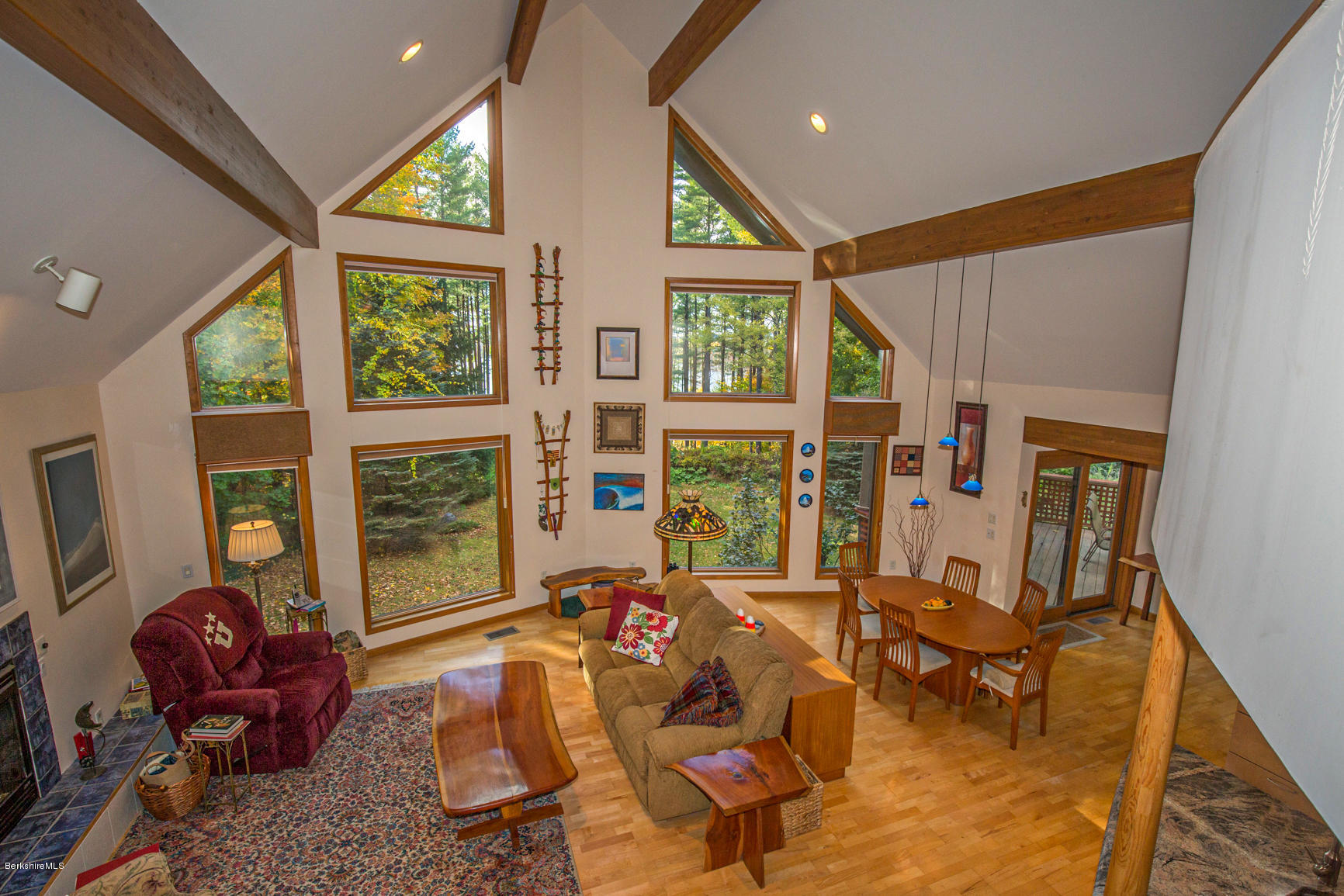 57 Golden Hill Road Lee, MA 01238 - Photo 14 of 43 a living room with furniture a floor to ceiling window and potted plant