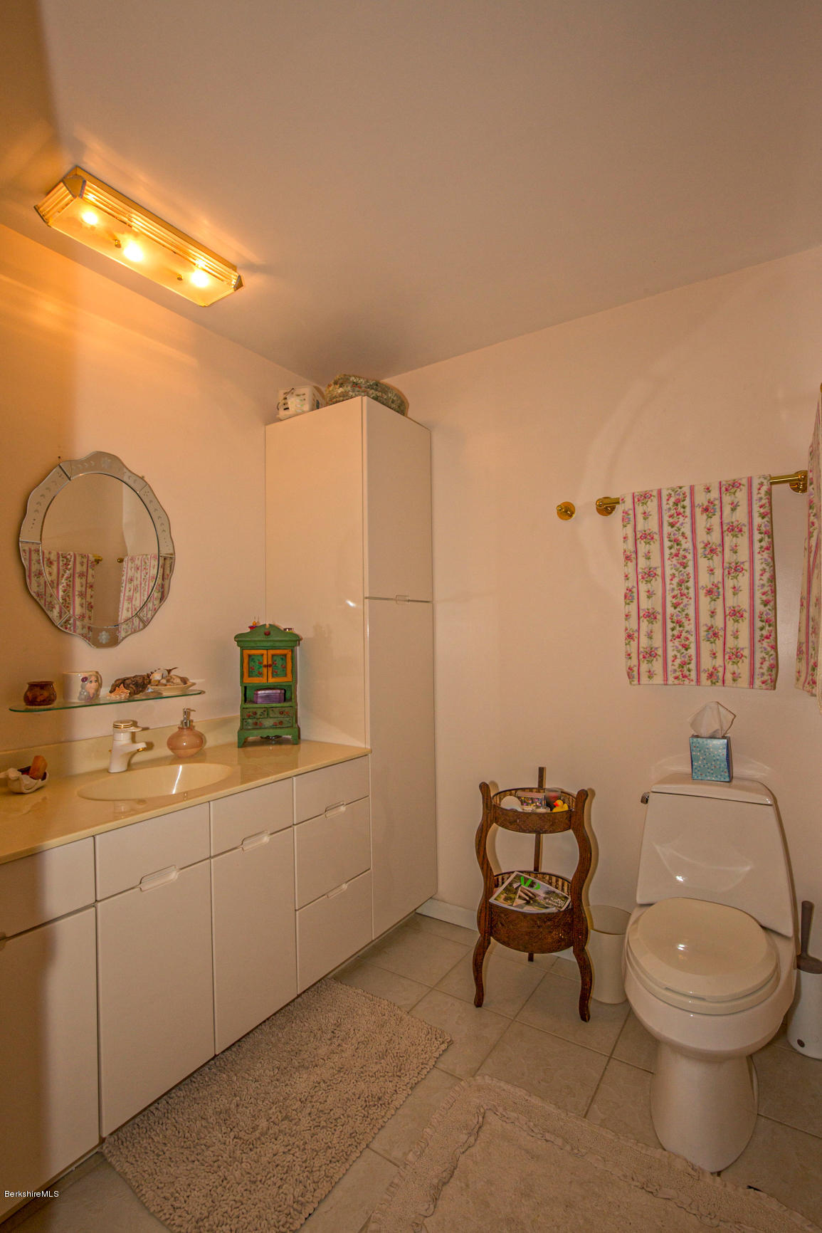 57 Golden Hill Road Lee, MA 01238 - Photo 22 of 43 a bathroom with a toilet a sink and mirror