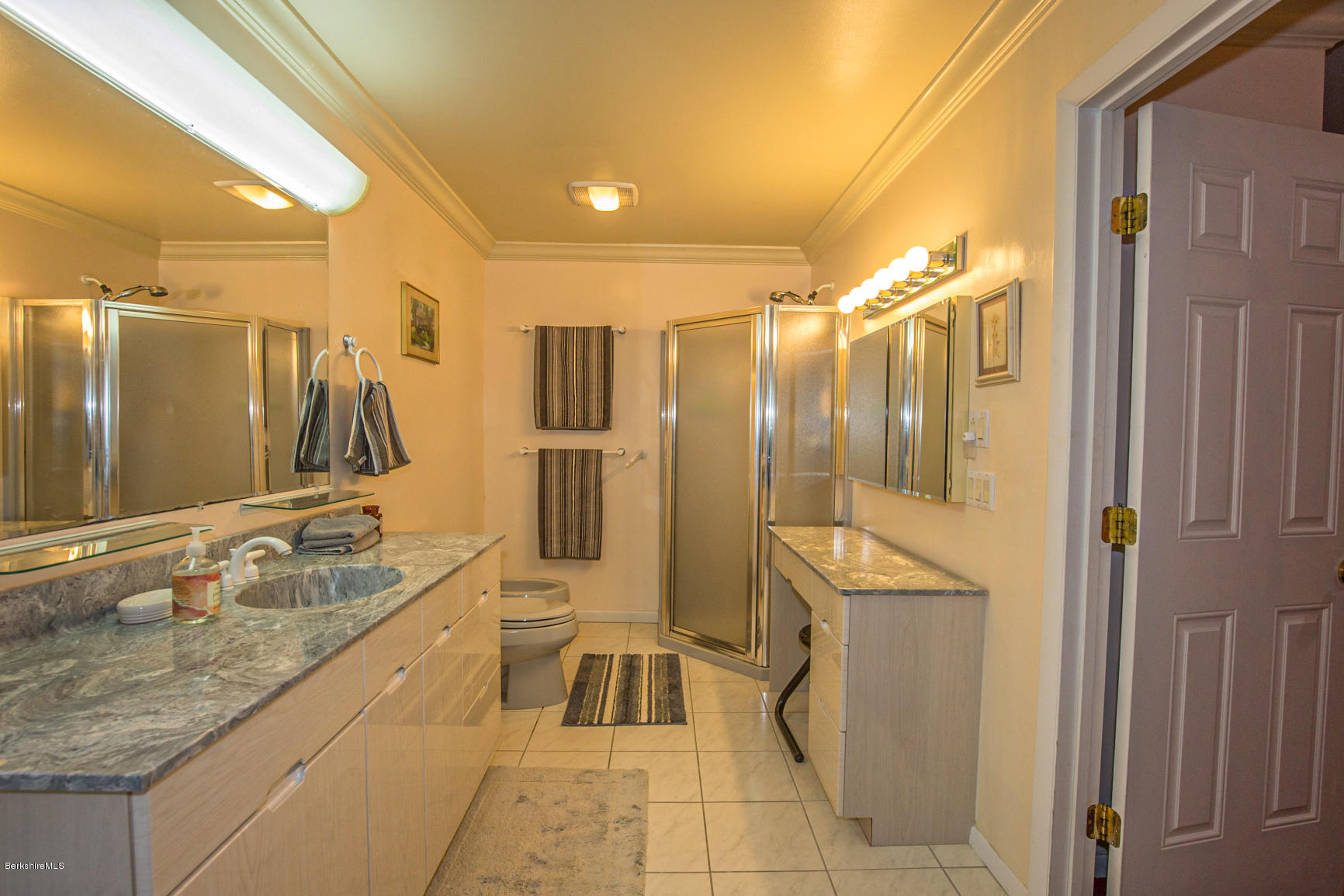 57 Golden Hill Road Lee, MA 01238 - Photo 27 of 43 a spacious bathroom with a granite countertop sink mirror and bathtub