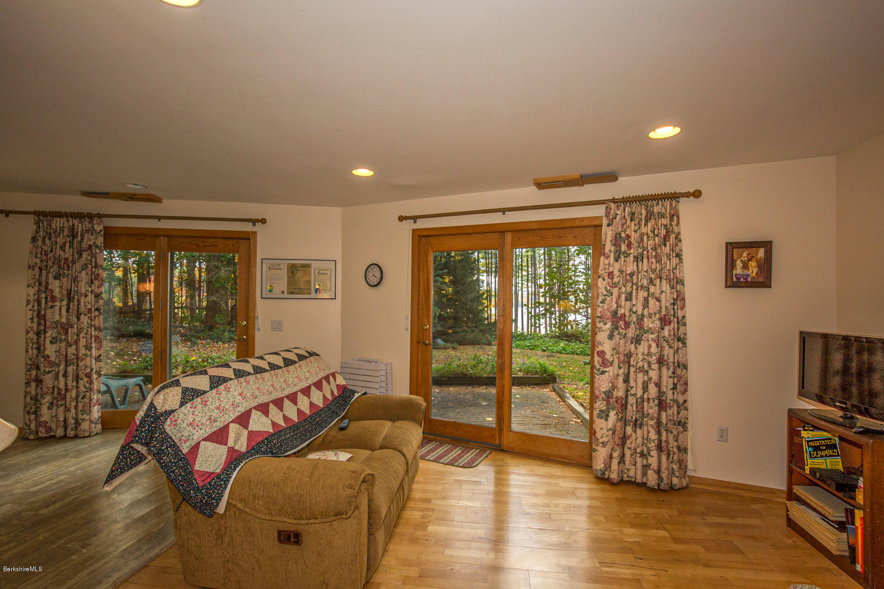 57 Golden Hill Road Lee, MA 01238 - Photo 30 of 43 a living room with furniture floor to ceiling window and wooden floor