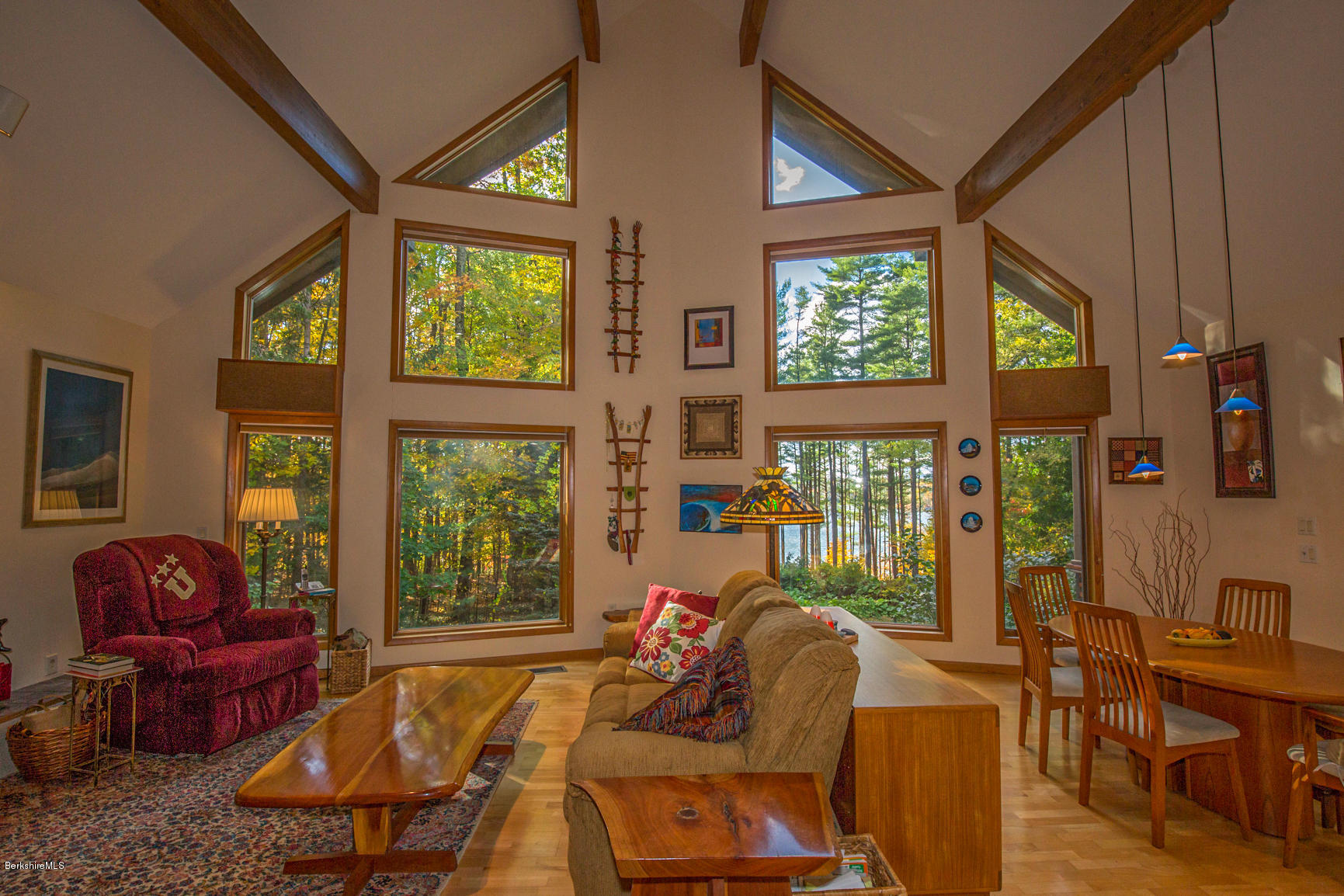 57 Golden Hill Road Lee, MA 01238 - Photo 4 of 43 a living room with furniture a flat screen tv and a window