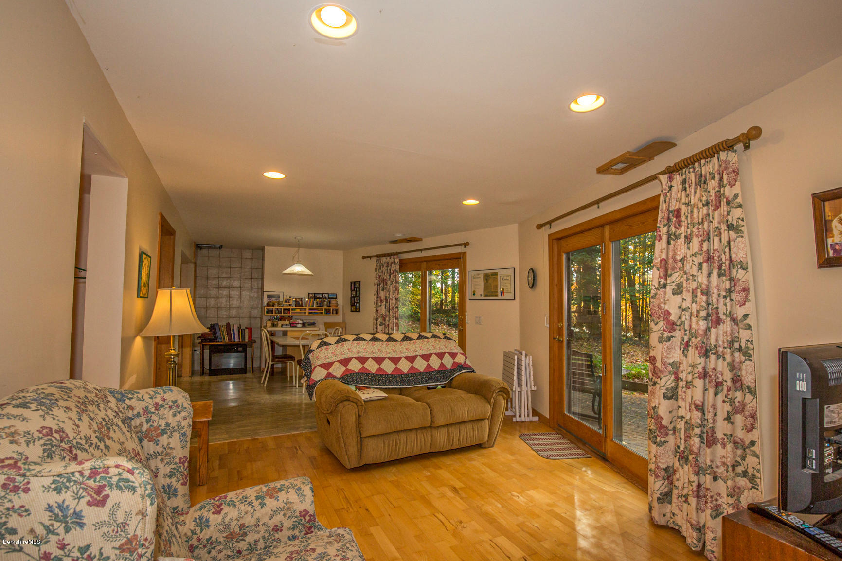 57 Golden Hill Road Lee, MA 01238 - Photo 32 of 43 a spacious bedroom with a large bed and a couch