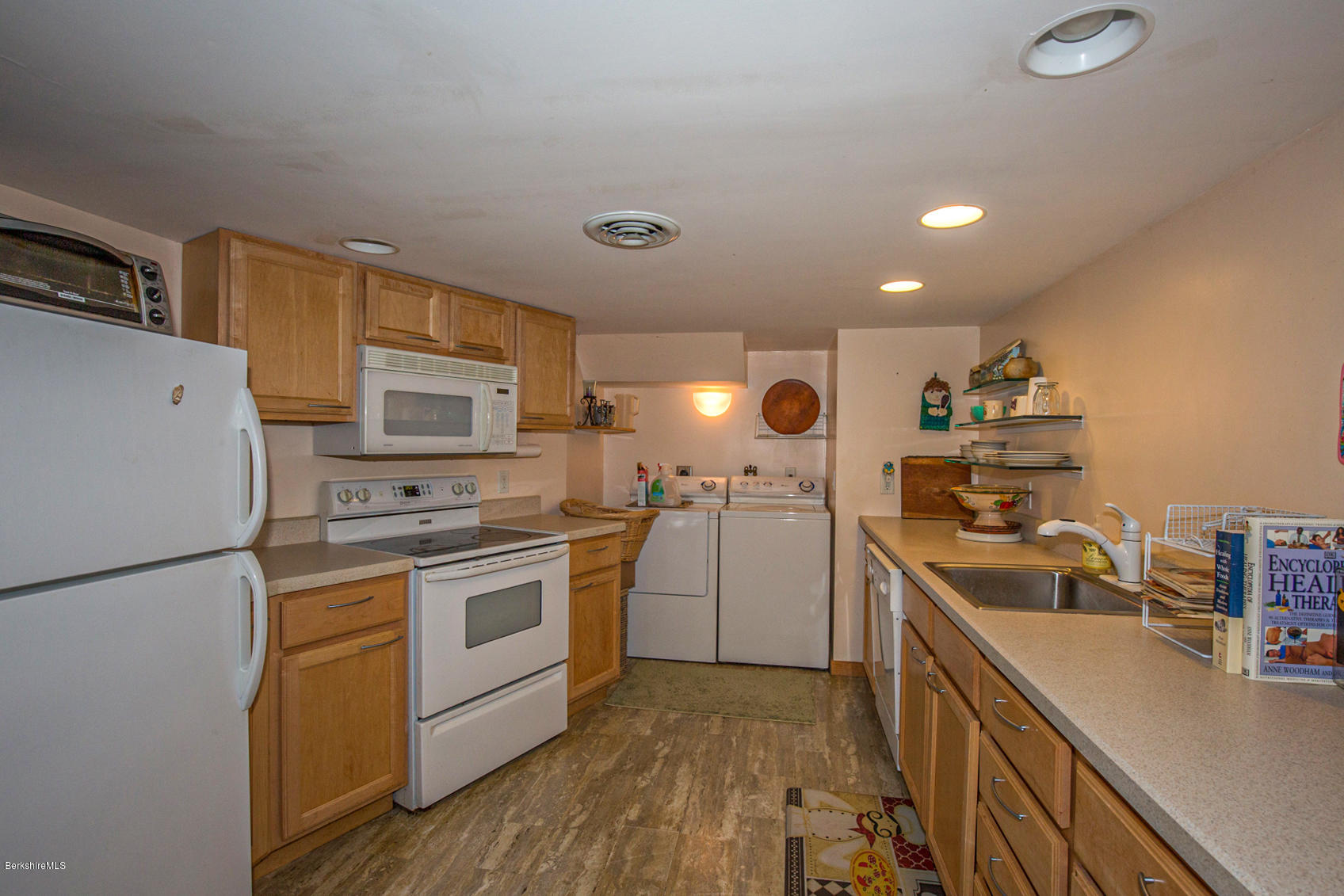 57 Golden Hill Road Lee, MA 01238 - Photo 33 of 43 a kitchen with a sink a stove and refrigerator