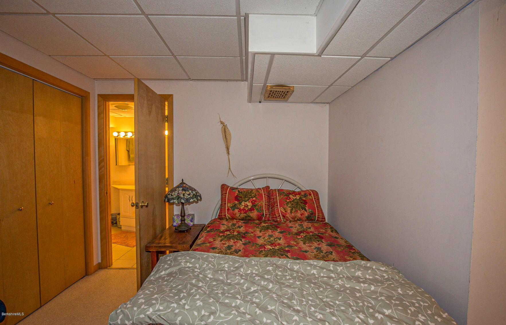 57 Golden Hill Road Lee, MA 01238 - Photo 35 of 43 a bedroom with a bed and wooden floor