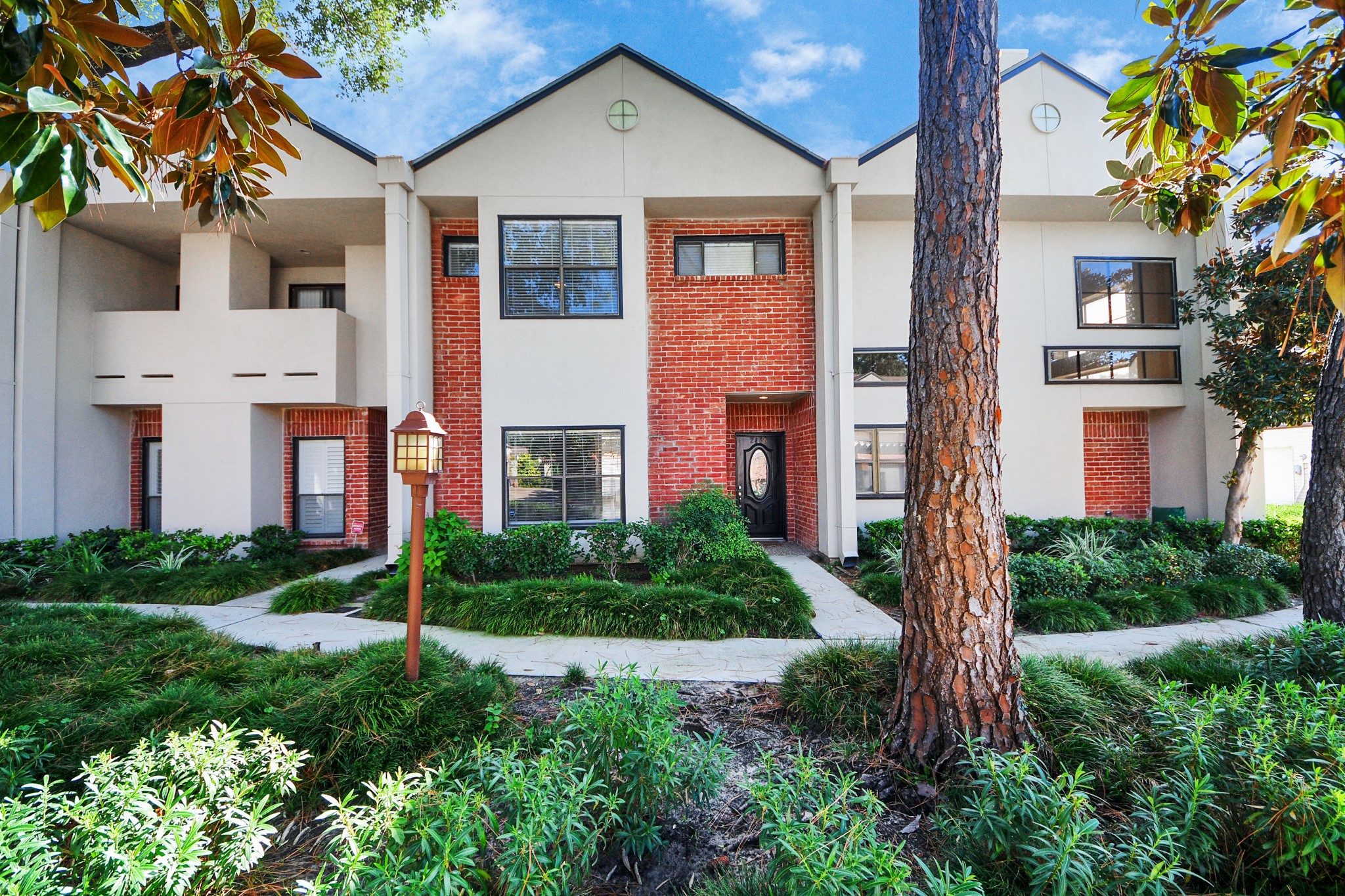 Welcoming front entry with landscaped walkway.