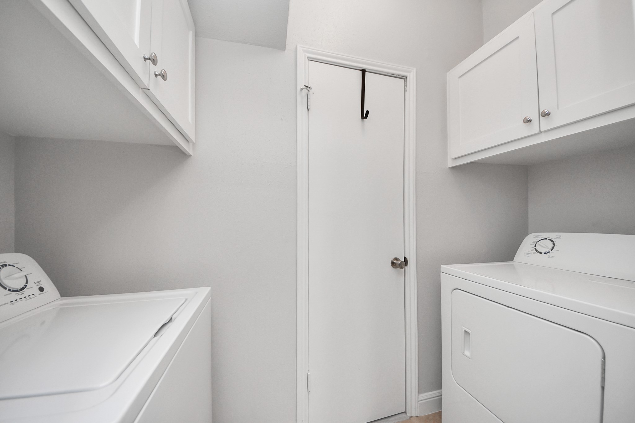2468 Bering Drive Houston, TX 77057 - Photo 15 of 30 Dedicated laundry space with built-in storage for added convenience.
