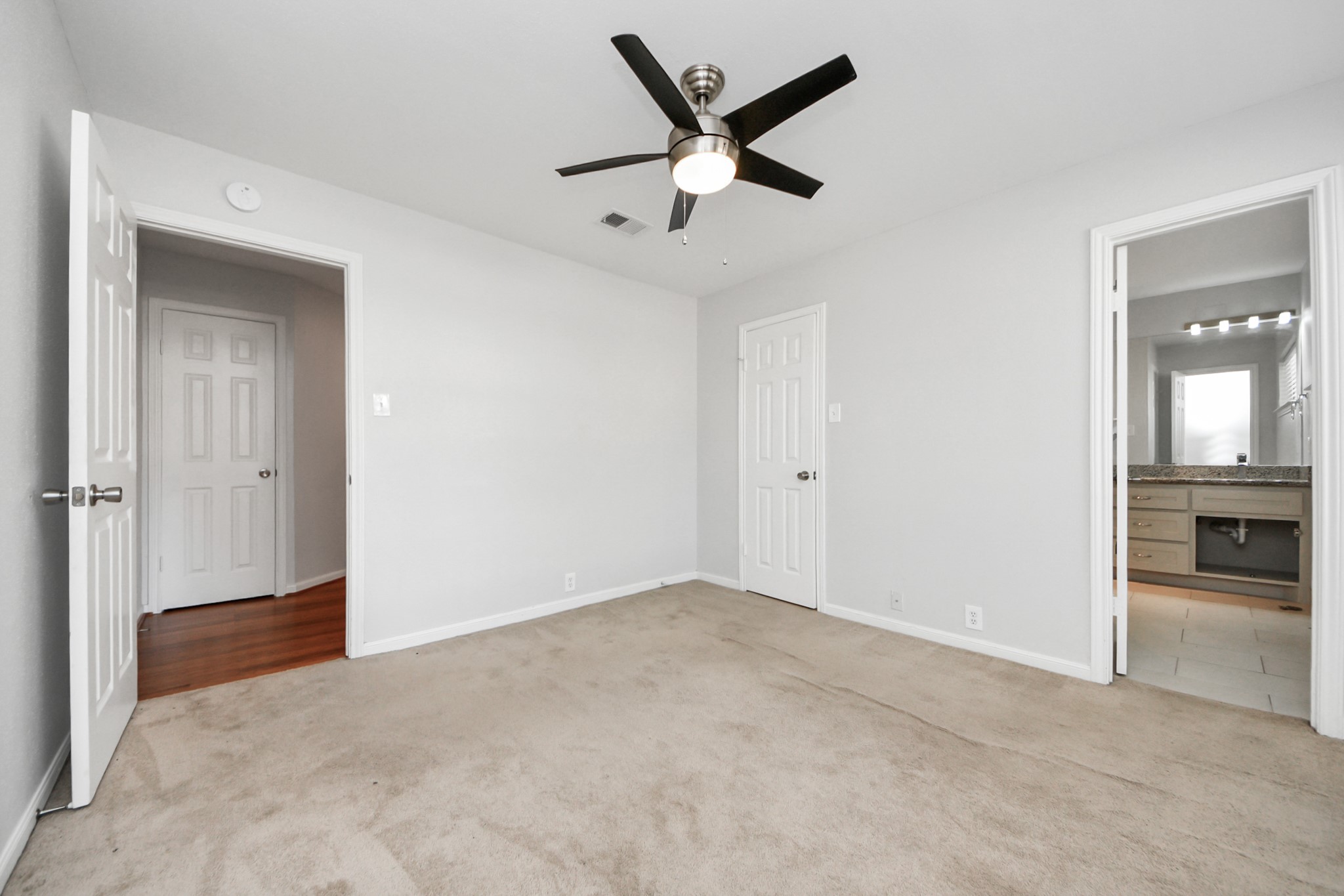 2468 Bering Drive Houston, TX 77057 - Photo 26 of 30 Bright and spacious bedroom perfect for guests, family, or a home office.