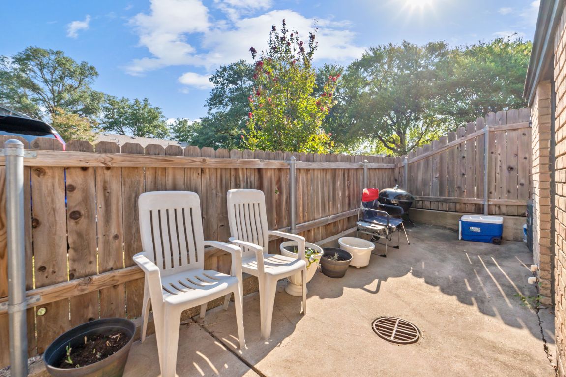1015 East Yager Lane, Unit 56 Austin, TX 78753 - Photo 9 of 9 a view of a chairs and table in backyard