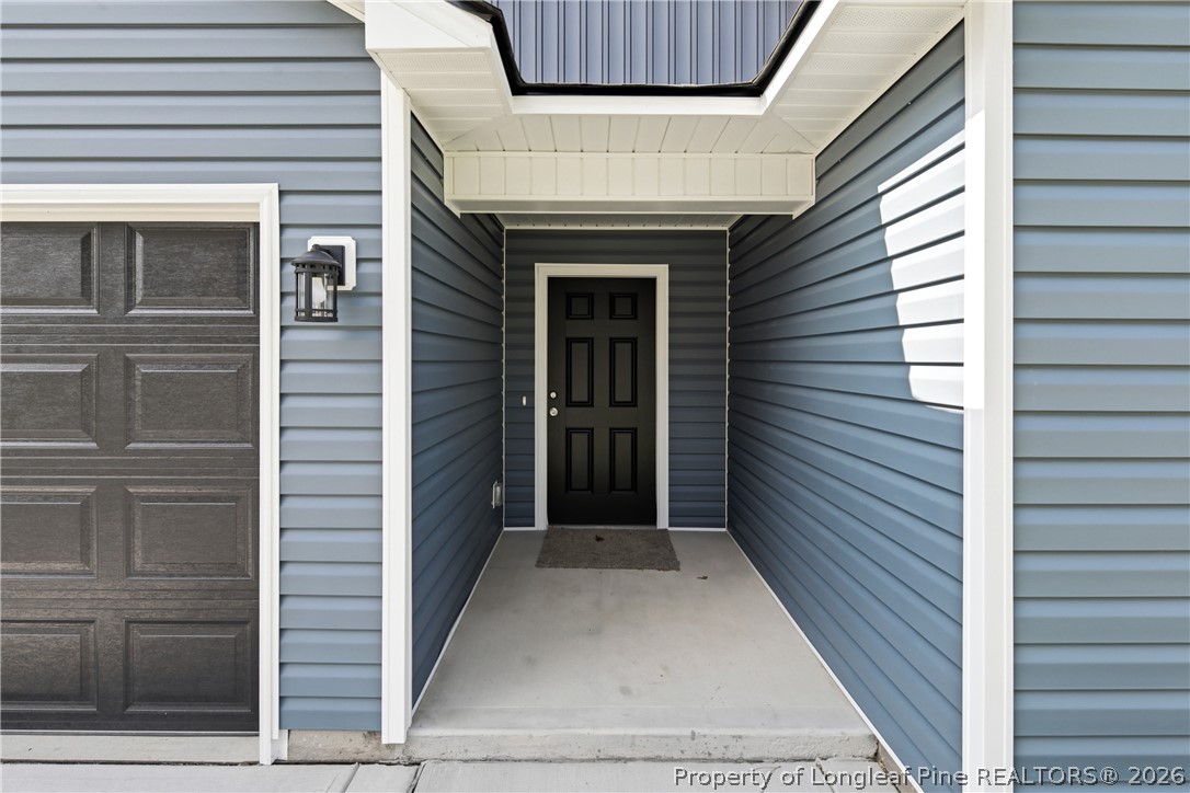 2629 Dumbarton Road Fayetteville, NC 28306 - Photo 3 of 48 Black exterior garage door and front door