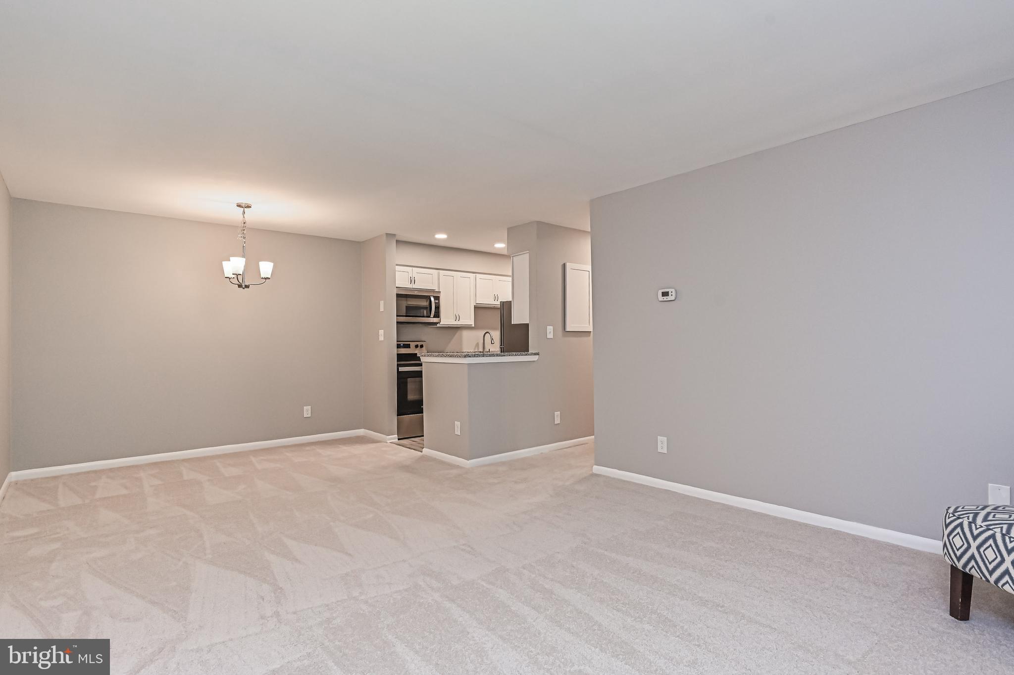 8110 Colony Point Road, Unit 216 Springfield, VA 22152 - Photo 7 of 28 Open living/dining/kitchen