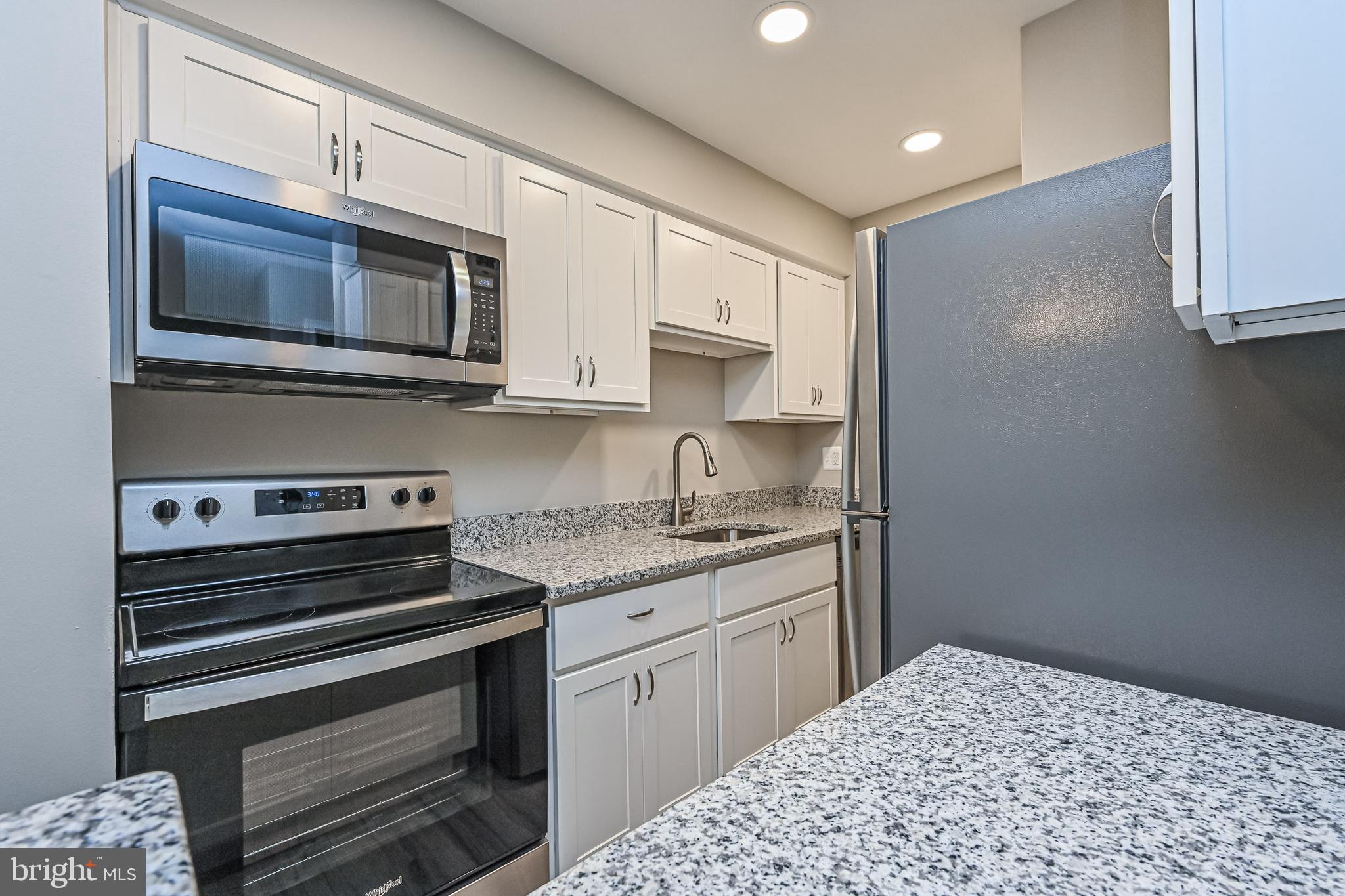 8110 Colony Point Road, Unit 216 Springfield, VA 22152 - Photo 10 of 28 Renovated kitchen w/built-in microwave